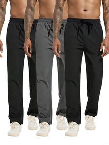 Detail showing elastic drawstring waistband on men's straight casual sports trousers
