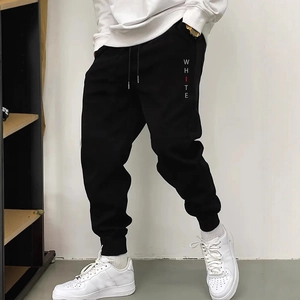 Men's black joggers with white lettering on the side and a comfortable drawstring waist