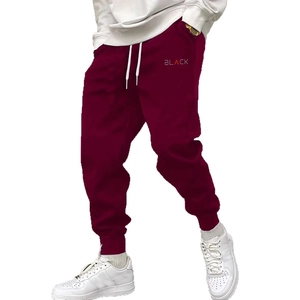 Men's wine red jogger pants with white drawstring and BLACK print on the leg