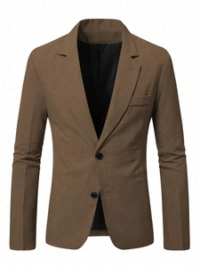 Detail of tan slim fit blazer featuring two-button closure and fine woven fabric texture