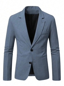 Detailed close-up of blue-grey textured fabric on a slim-fit two-button men's blazer