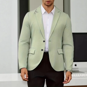 Detail of slim fit light green men blazer with classic lapels and two-button closure