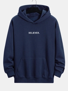 Detail of navy blue hoodie featuring minimalist white BELIEVER letter print and pocket