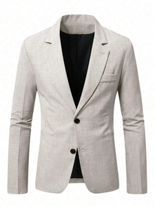 Detail of single-breasted blazer showing textured linen-like fabric and two black buttons