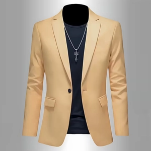 Detail of light khaki blazer with notched lapel, single button, and classic flap pockets