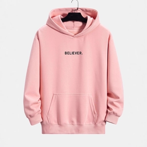 Men's loose light pink hoodie with BELIEVER print, featuring front pocket and ribbed cuffs