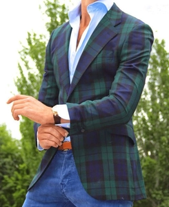 Detail of green and blue plaid casual blazer with notch lapel and single-breasted design