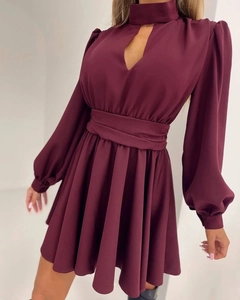 Macro shot of the burgundy mini dress featuring cutout neckline and waist tie details