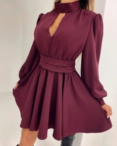 Detail of burgundy mini dress featuring hollow-out V-neck and puff long sleeves design