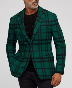Close-up of the deep green plaid wool blend fabric texture on men's slim fit blazer