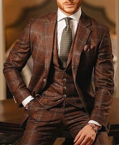Detail view of brown plaid three-piece suit with classic check pattern and notch lapel