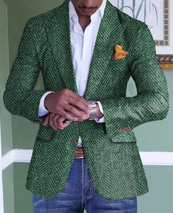 Detail of green herringbone blazer featuring single-breasted buttons and notch lapels