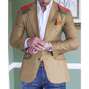 Detail of khaki slim blazer featuring red and green shoulder stripes and pocket square