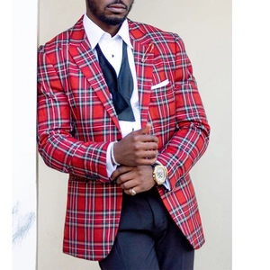 Close-up of red tartan plaid suit jacket featuring classic notched lapels and wool texture