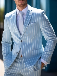 Detailed view of single-breasted blue striped suit with printed tie and white shirt