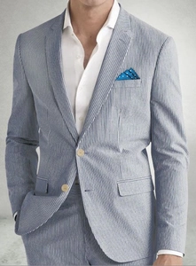 Detail of light blue seersucker striped blazer with two buttons and pocket square