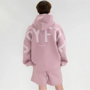 Detail view of purple hoodie with Joyful Romans 12:12 foam print on the back and sleeve