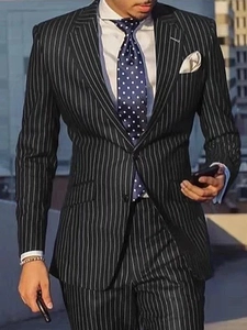 Detailed view of slim fit single-breasted pinstripe suit for men in a professional setting