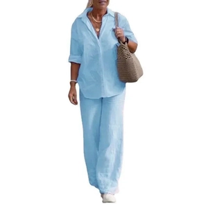 Detail view of light blue linen-textured two-piece set featuring shirt and wide-leg pants