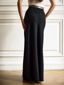 Elegant high-waisted black satin mermaid skirt with a glossy finish and long floor-length cut