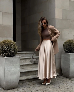 Chic satin maxi skirt in champagne silk finish with elegant high waist and fluid drape