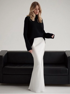 Elegant high waist white satin fishtail skirt paired with black knit sweater outfit