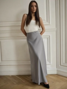 Detailed view of the smooth texture and silky sheen of the elegant grey satin maxi skirt