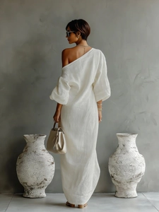 Elegant white one-shoulder maxi dress with puff sleeves and textured fabric for women