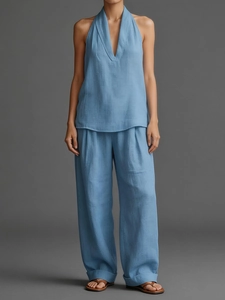 Detailed fabric texture of the light blue sleeveless top and wide-leg trousers linen set