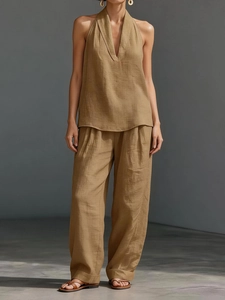 Detail of camel linen sleeveless halter top and wide leg pants set with breathable texture