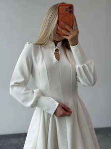 Elegant white long sleeve dress with keyhole neckline and slim fit waist design