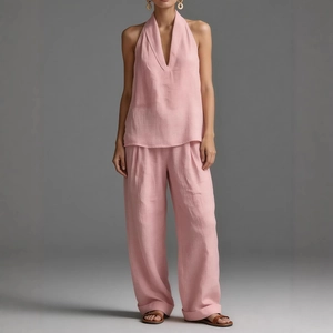Chic pink sleeveless halter V-neck top with matching wide-leg trousers two-piece set