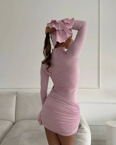 Close-up of the detailed ruching and slim fit texture on a pink flare sleeve dress