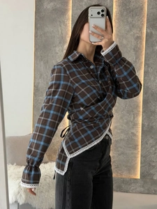 Detail of vintage plaid long sleeve shirt with white lace trim and wrap tie-up waist design