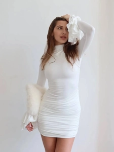 Elegant white mock neck bodycon dress with flared ruffle sleeves and ruched side detail