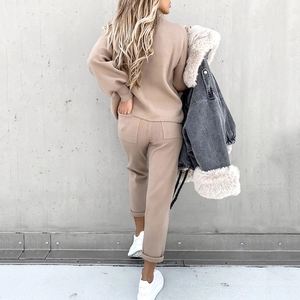 Detail of oatmeal knitted lounge set with fleece texture and matching trousers for women