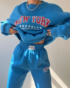 Close-up of blue sweatshirt set showing New York Brooklyn print and soft fleece texture