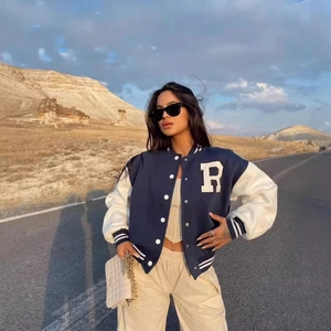 Vintage American style varsity jacket in navy blue and white with letter R patch