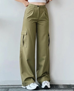 Detail view of military green high-waisted cargo pants with side flap pockets