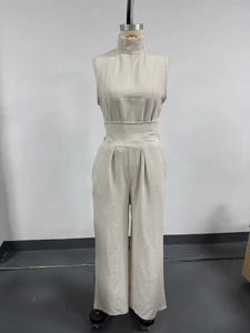Women's beige mock neck sleeveless wide leg jumpsuit with pleated waist texture