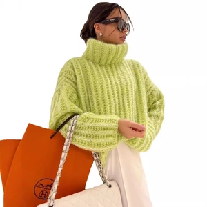 Fluorescent green turtleneck chunky knit sweater with ribbed texture and oversized fit
