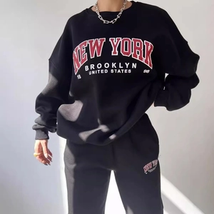 Women's black New York tracksuit with fleece-lined sweatshirt and matching joggers