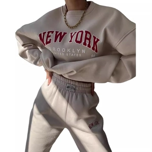 Cream white two-piece sweatsuit featuring New York graphic print sweatshirt and joggers