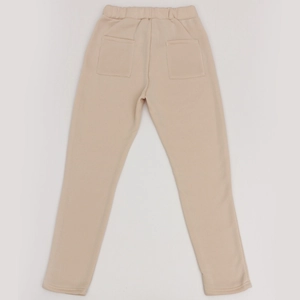 Detail view of beige fleece trousers back with elastic waist and large patch pockets