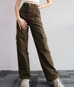 Detailed view of cargo pants with large flap pockets and olive green twill fabric