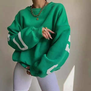 Oversized grass green sweatshirt with white number print on sleeve for casual style