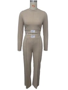Detail view of khaki ribbed lounge set showing fabric texture and woven brand label