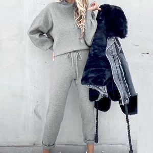 Women's minimalist grey fleece tracksuit featuring long sleeve top and drawstring joggers
