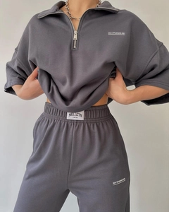 Detail of dark grey short sleeve tracksuit with lapel zipper and logo embroidery