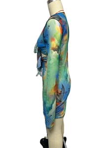 Detail of colorful watercolor print and butterfly pattern on Y2K tie-up long sleeve dress